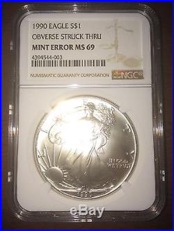 1990 USA $1 Silver Eagle OBVERSE STRUCK THRU MINT ERROR MS 69 NGC Coin