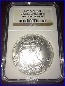 2005 USA $1 Silver Eagle OBVERSE STRUCK THRU MINT ERROR MS 69 NGC Coin