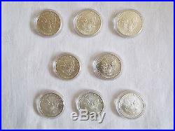 8 x 1 oz silver American Eagle 1991 / 1999 / 2005 / 2006 Liberty Dollar in cases