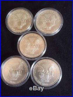 Five 2011 Silver American Eagles In Capsules