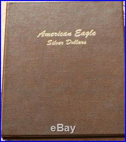 SILVER AMERICAN EAGLE COLLECTION (32 COINS) in a DANSCO ALBUM MISSING 2011